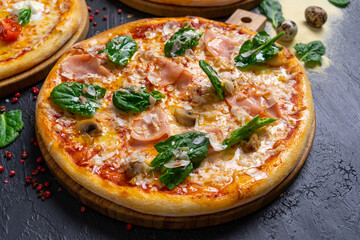 Italian pizza with cheese and mushrooms on a wooden background (top view close)