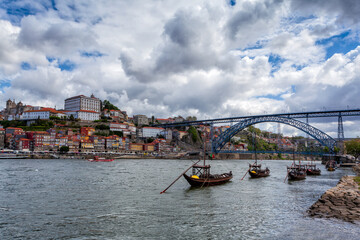 Oporto, Portugal, Europe. Postcard from the picturesque city of Porto, amazing travel destination in Portugal. View to the historic center, Douro River with its beautiful bridge and old monuments.