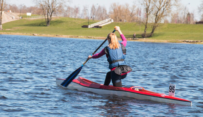 Athletes canoeists during a sprint race in a rowing competition