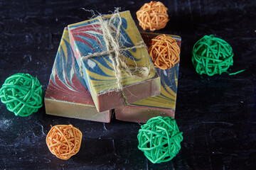 Fragrant multicolored organic handmade soap and bright decor .