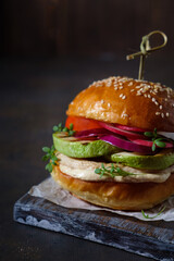 Burger with chicken and vegetables cooked on the grill, homemade pastries, healthy, natural food