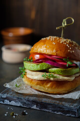 Burger with chicken and vegetables cooked on the grill, homemade pastries, healthy, natural food