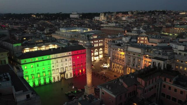 Palazzo Chigi in Rome seat of the Italian government. The tricolor of the Italian flag illuminates the facade