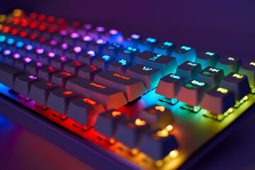 RGB gaming keyboard. Bright colorful keyboard, soft focus. Mechanical keyboard with RGB light, blurred background - obrazy, fototapety, plakaty