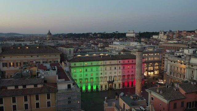 Palazzo Chigi in Rome seat of the Italian government. The tricolor of the Italian flag illuminates the facade