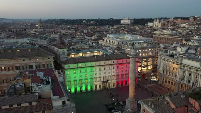 Palazzo Chigi in Rome seat of the Italian government. The tricolor of the Italian flag illuminates the facade