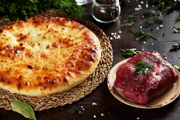 National Caucasian dish - Ossetian pies with cheese, potatoes, herbs, cottage cheese, beef, mushrooms