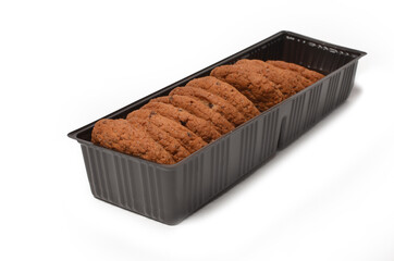 Oatmeal cookies with raisins in a plastic container on a white background