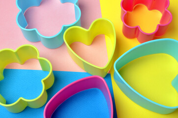 colored plastic bakeware on a colored background