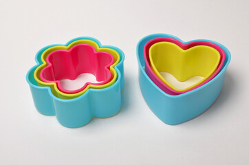 colored plastic bakeware on white background