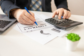 Businessman signs a contract. partial focus. close-up.