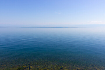 Horizon above water. Clean water in Lake Baikal at Siberia, Russia. Summer landscape