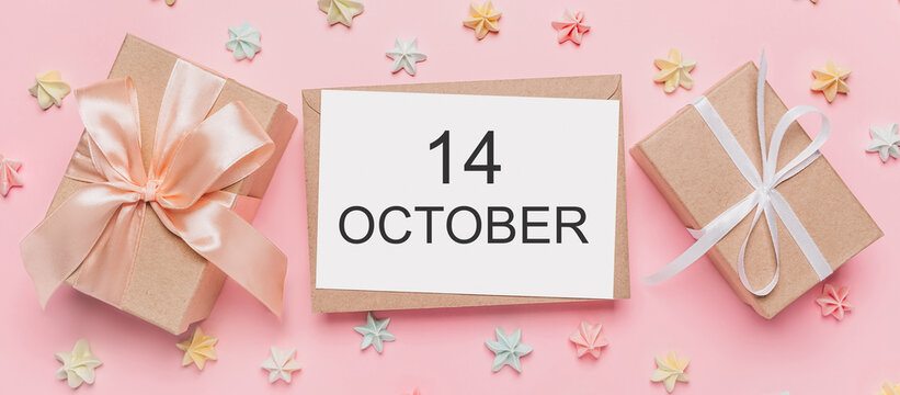 Gifts with note letter on isolated pink background with sweets, love and valentine concept with text 14 October