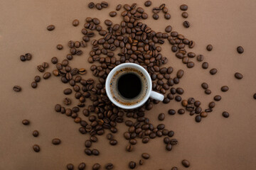 Coffee and coffee beans on a brown background