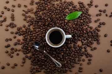 Coffee and coffee beans on a brown background