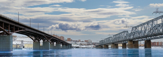 Winter view of the city bridges over the Yenisei river in Krasnoyarsk, Russia. Translation: Siberia