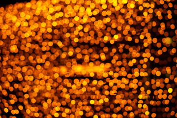 background of many beautiful blurry lights garlands on a dark background. beautiful bokeh. festive decoration with garlands