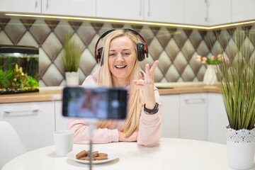 Girl blogger with blonde hair to chat on phone