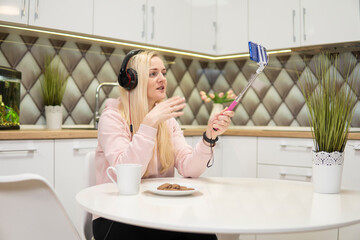 Girl blogger with blonde hair to chat on phone