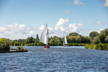 Sailboats on the Kagerplassen  (Boerenbuurt) with people sailing in the South-Holland municipality...