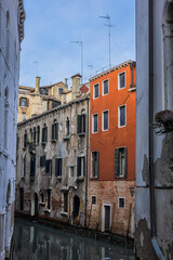 Fototapeta na wymiar View of old traditional buildings located near the canal. Venice, Italy.