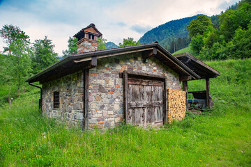 Obraz premium Old stone house in the mountains of Val Sabbia, province of Brescia, in upper Val Trompia, in Lombardy, Italy.