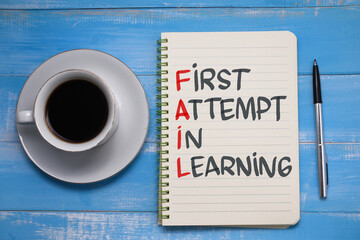 Fail first attempt in learning, text words typography written on paper against wooden background, life and business motivational inspirational