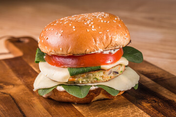 Vegetarian burger on wooden plate