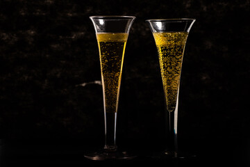 two vintage glasses of champagne are on the table