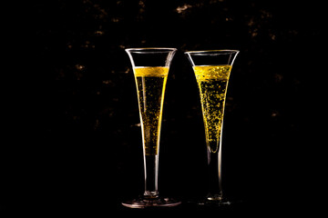 two vintage glasses of champagne are on the table