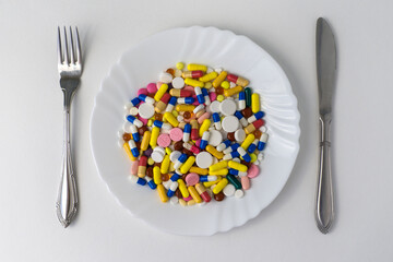 A bunch of pills on a plate