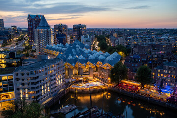 Fototapeta na wymiar Rotterdam, the Netherlands - July 31 2020: view from the Dutch White house over the old harbor of Rotterdam with local bars and restaurants.