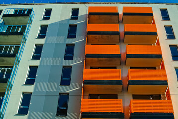 RIGA, LATVIA-January 27, 2021: modern apartment building with orange balconies balconies