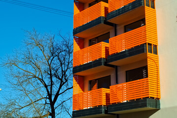RIGA, LATVIA-January 27, 2021: modern apartment building with orange balconies balconies