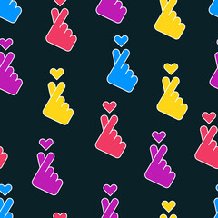 Korean love sign. Finger heart gesture. Sarangae icon. Seamless pattern on black background.