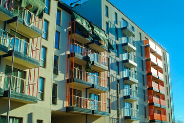Obraz premium RIGA, LATVIA-January 27, 2021: modern apartment building with orange balconies balconies