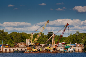 River cranes on a dock
