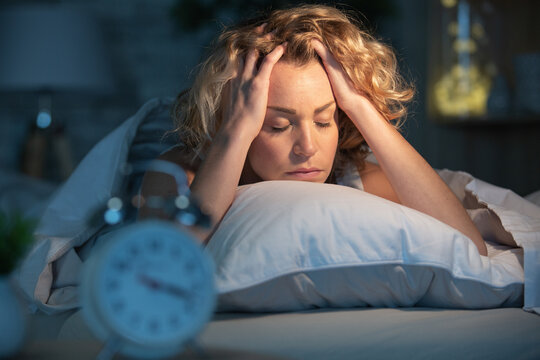 sleepless vwoman suffering from insomnia close upv