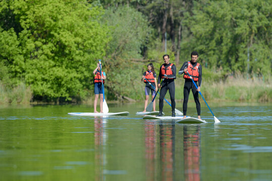 stand up paddle group on a lake