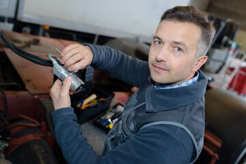 mechanician at work in the auto repair garage