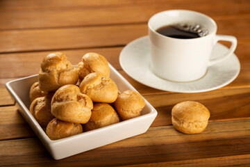 Delicious profiteroles on the table. Profiteroles dessert. Image with selective focus.