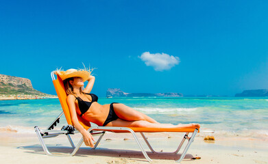 girl in black bikini and with hat on Balos beach