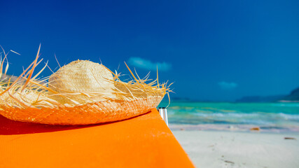 Tropical hat on lounger at sea lagoon of Balos