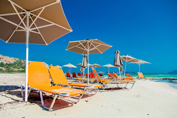 parasol and sunbeds at sea lagoon of Balos