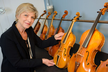 posing next to the violins