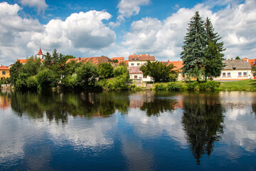 Fototapeta na wymiar the old town reflecting on the river / Czech Republic, Horazdovice, Otava river