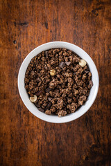 Chocolate breakfast cereal. Morning granola in bowl