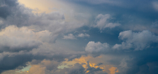 a natural phenomenon - beautiful thunderclouds in the sky. a combination of warm and cold colors in cumulus clouds. sky after rain