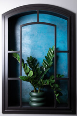 Faux window in the wall with painted blue view and plastic green plant on windowsill