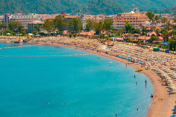 Mediterranean coast, beaches of the city of Marmaris. Turkey. Sunny bright day on the beach. Rest and travel to the sea.